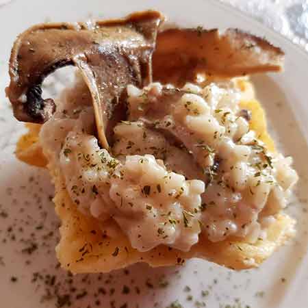 Risotto cremoso funghi e salsiccia